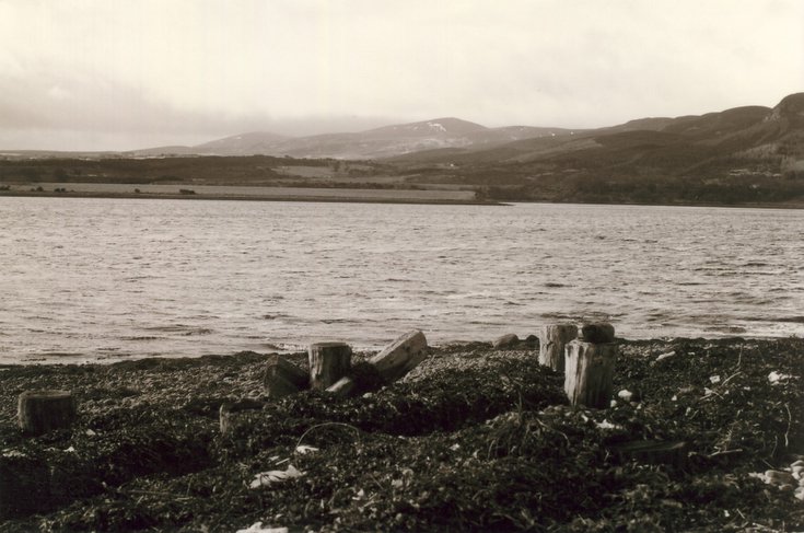 Remains of pier and view south at Newton Point