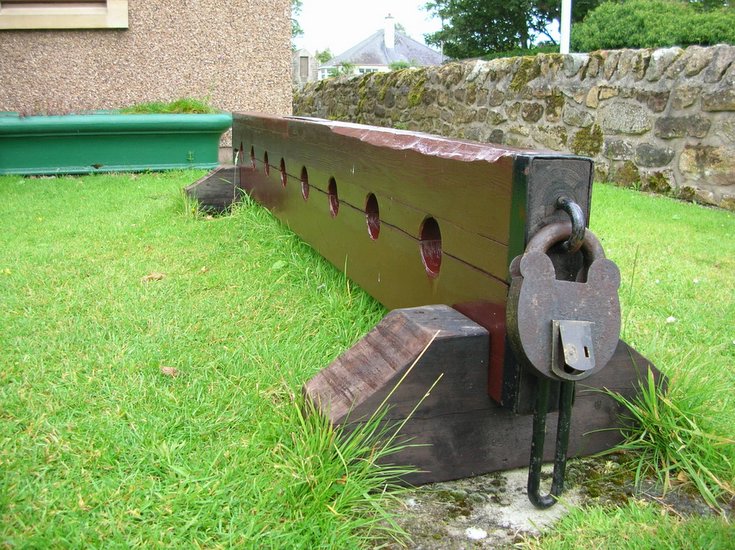 Photograph of lock in postion on replica of Dornoch Stocks