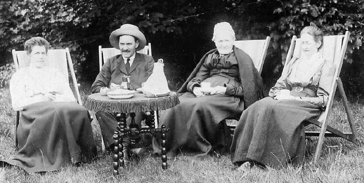 Four people in deckchairs