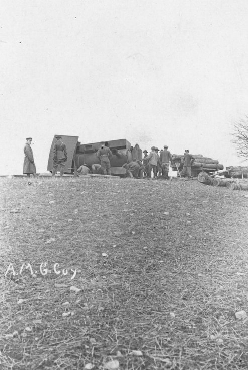 CFC troops inspecting an overturned railway locomo