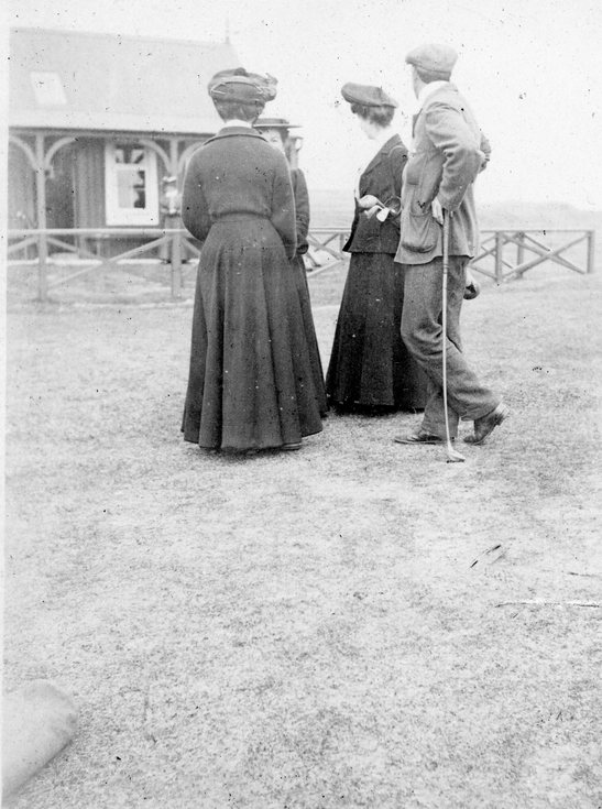 Three ladies and a gentleman on the golf course