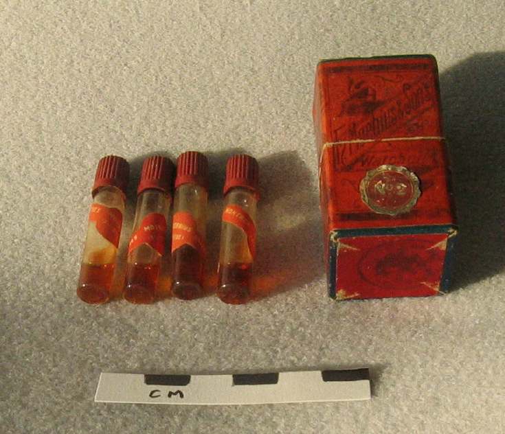 Box of bottles of watch oil