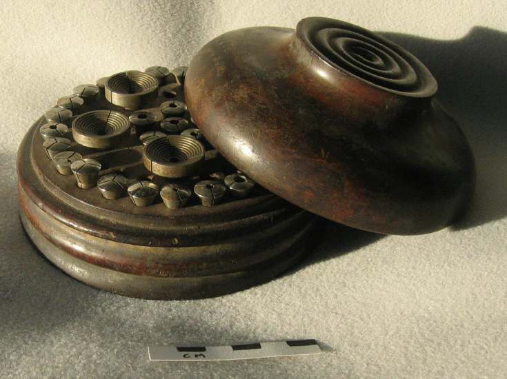 Box containing watchmaker's lathe chucks