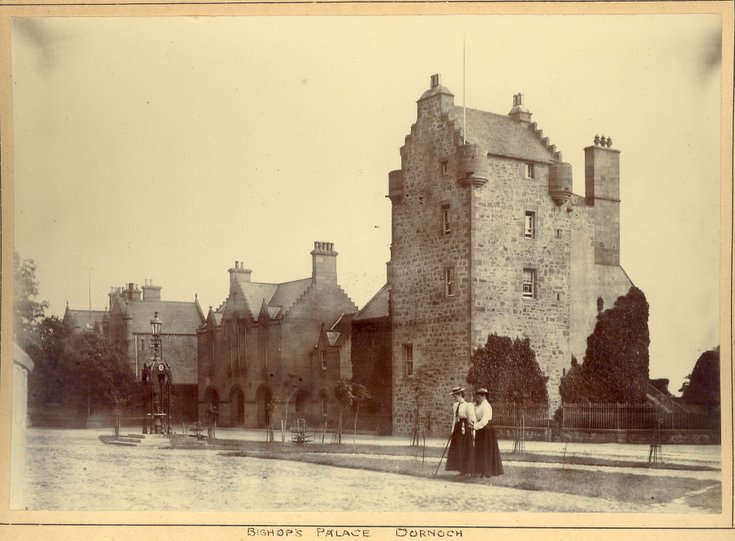 Two ladies standing on the green in Dornoch