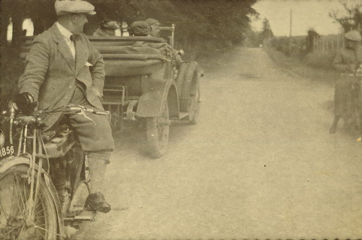 Motor Cyclists, with open-top car