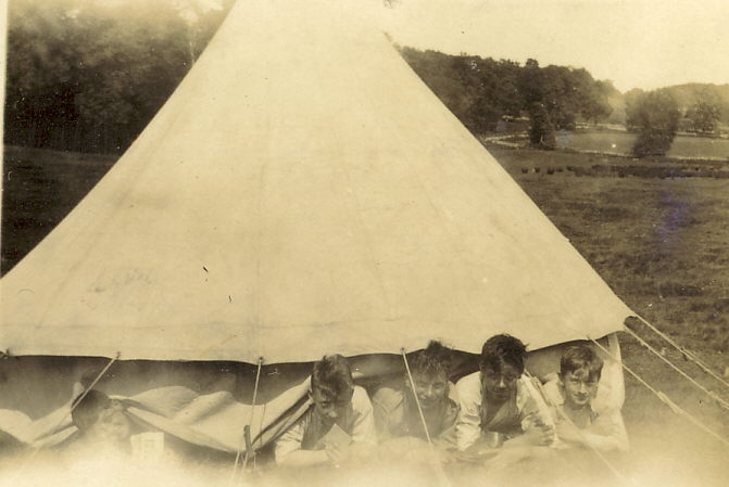 Scouts emerging from bell tent