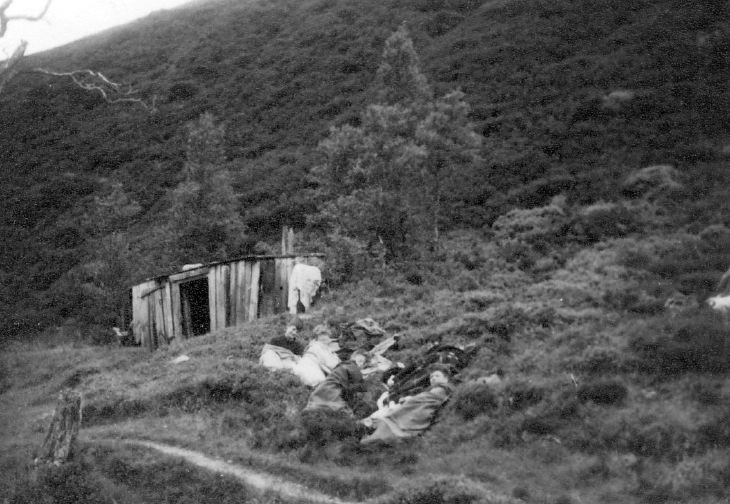 Scouts wrapped in blankets beside track