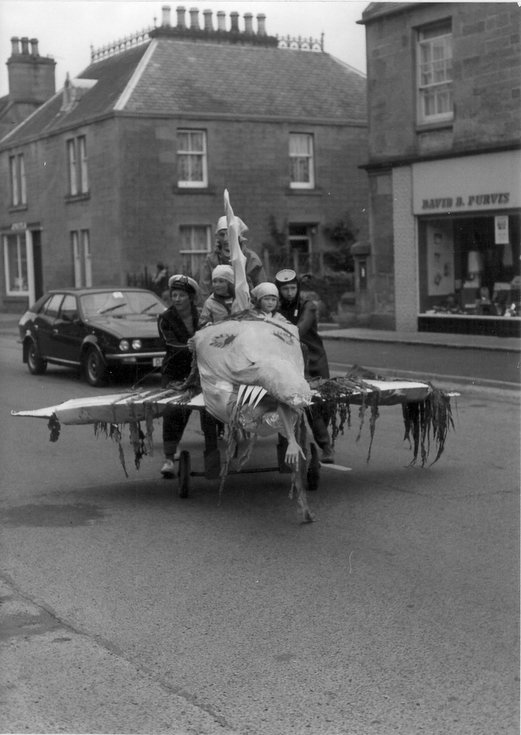 'Jaws' inc Castle Street during pram race, Dornoch Festival week