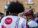Happy fans in colourful cycling apparel gather in Dornoch