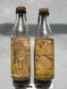 Olive bottle sold by R R Johnstone of Dornoch