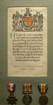 Framed scroll and medals Drummer John Gillespie